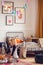 Blonde kid playing with toys in vintage styled unisex bedroom