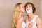 Blonde kissing her boyfriend with shaving foam on the face