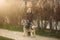 Blonde lady model poses to photographer with husky dog