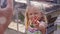 Blonde little girl poses to daddy and shows peace and doll