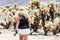 Blonde long hair female walks through the Jumping Cholla cactus