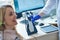 Blonde long-haired woman having a hearing check at the hospital