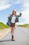 blonde making gesture while hitchhiking