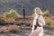 Blonde Model in Desert With Gun