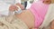 Blonde pregnant woman having a sonogram scan