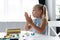 blonde preschooler girl molding plasticine in