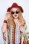 Blonde sensual woman in cow-girl red hat and sunglasses
