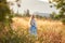 Blonde slavic girl on the field in the evening