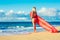 Blonde Surfer Girl on the Beach