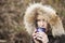 Blonde Woman with Beautiful Blue Eyes Drinking Coffee