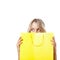 Blonde woman behind yellow shopping bag
