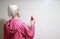 Blonde Woman Brushing Hair With Comb At Bathroom