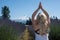 Blonde woman does a yoga pose in a lavender field in Mt Hood Oregon, overlooking Mount Hood