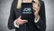 Blonde woman in formal suit presents a tablet with the words \'Job Search\' on the screen. A concept of recruitment process. Interns