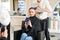 Blonde woman in hairdressing beauty salon