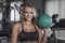 Blonde woman holding medicine ball