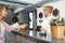 Blonde woman hotel guest checking-in at front desk in hotel