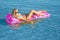 Blonde woman with inflatable raft