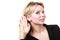 Blonde woman making listening gesture