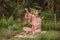 Blonde woman in a pink kimono playing on meditative Himalayan Tibetan music