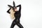 blonde woman posing in rabbit black mask and bodysuit