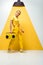 Blonde woman posing with retro boombox on white and yellow