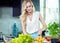 Blonde woman preparing a dinner dish