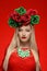 Blonde woman with red dress and flower wreath