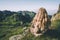 Blonde Woman relaxing on mountains summit