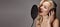 Blonde Woman Singing Song in Recording Studio with Microphone, Headphones. Glamour Diva Creates Musical Track. Karaoke