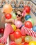 Blonde woman with sunglasses playing in her bath tube with bright colored balloons. Sensual girl with white red striped stockings