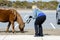 Blonde woman tempting fate by getting too close to wildlife to photograph it