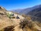 Blonde woman traveler walks along the Colca Canyon in Chivay, Peru, South America. Condors can be seen flying among the mountains