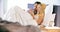 Blonde woman using smartphone with boyfriend in bed at morning. Couple in love morning wake up at home in bedroo