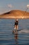 Blonde Woman Wakboarding at Sunset