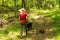 A Blonde Woman Walks Her Big and Small Dogs on a Trail in Wendell City Park.