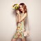 Blonde young woman in elegant floral dress