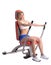 Blonde young woman on hydraulic exerciser