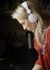 Blonde young woman listens music by headphones