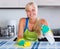 Blondie dusting in residential kitchen