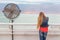 Blondie young woman posing balcony ventilator sea view.