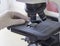 Blood analysis microscope, hand, glove, close-up