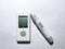 A blood glucose meter and a pen for piercing fingers. Measurement of glucose levels