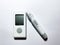 A blood glucose meter and a pen for piercing fingers. Measurement of glucose levels