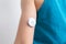 Blood glucose sensor on a child`s arm. Sensor for remote measurement of blood glucose levels using NFC