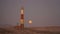 Blood Moon rising at the Luederitz Lighthouse in Diaz Point near LÃ¼deritz, Namibia, Africa.
