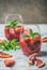 Blood orange and strawberry summer Sangria on marble table