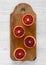 Blood oranges halved on rustic wooden board over white wooden background, top view. Flat lay, overhead, from above. Close-up