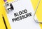 Blood pressure, text on notebook with stethoscope, health concept