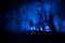 bloodthirsty zombies attacking. hungry zombies in the woods. Silhouettes of scary zombies walking in the forest at night